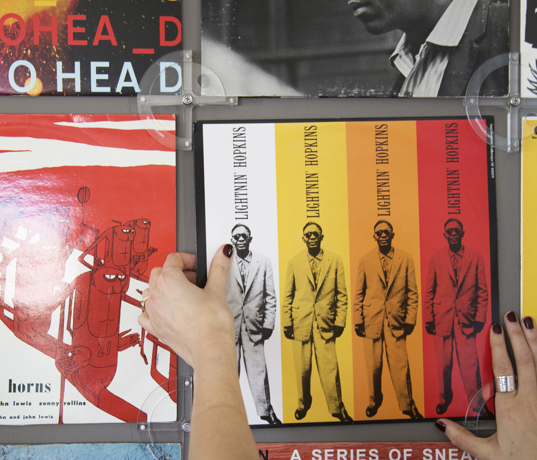 User reaching for Lightnin' Hopkins album from Spinmount album collage.